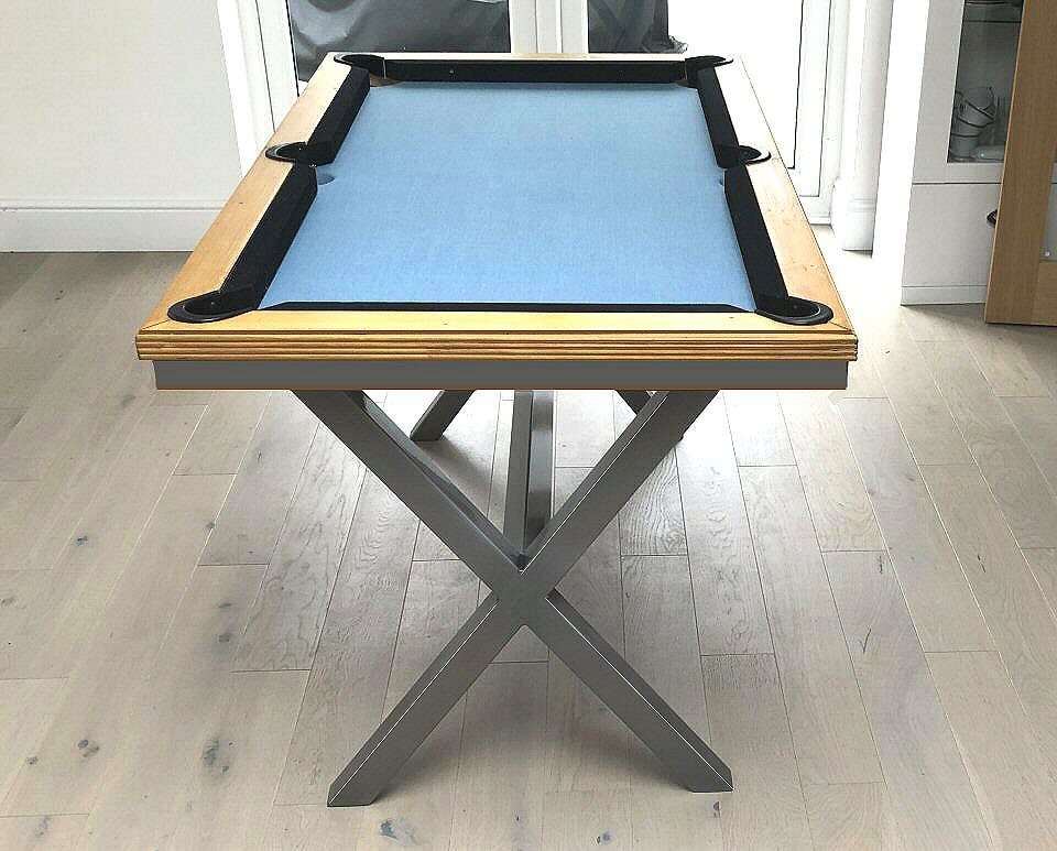 enf view of pine pool table with blue cloth