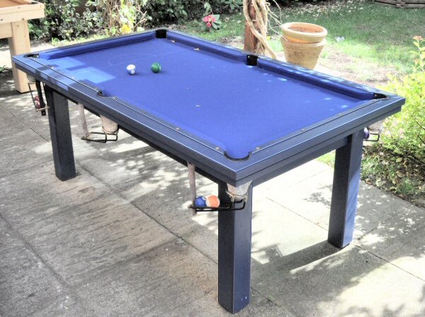 6ft pool table in blue set in a garden